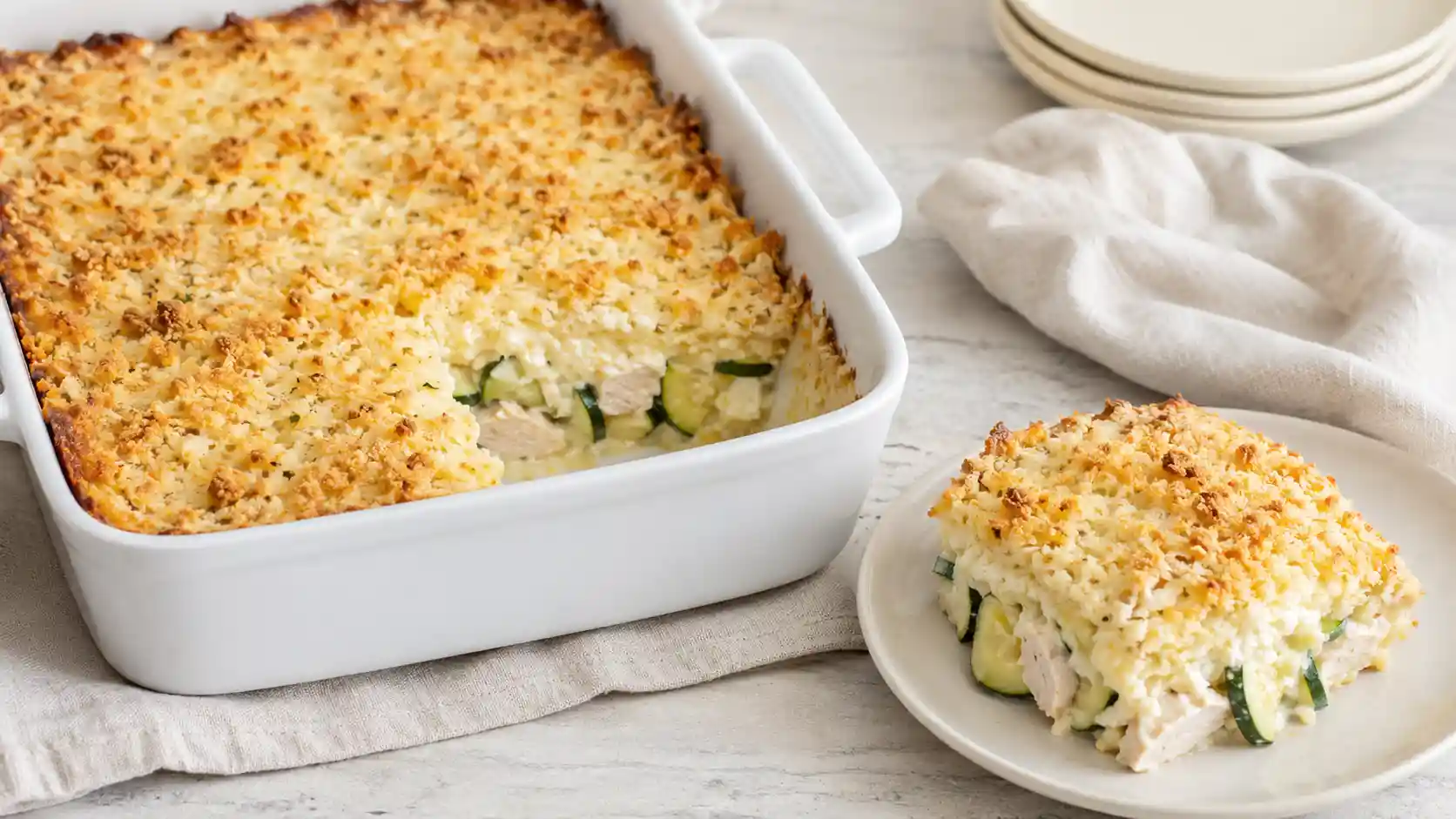 Chicken zucchini casserole with a creamy cottage cheese filling and golden breadcrumb topping.