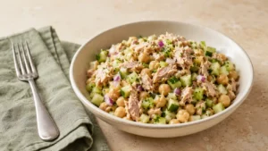 Tuna chickpea salad with cucumber, celery, red onion, parsley, and lemon Dijon dressing.