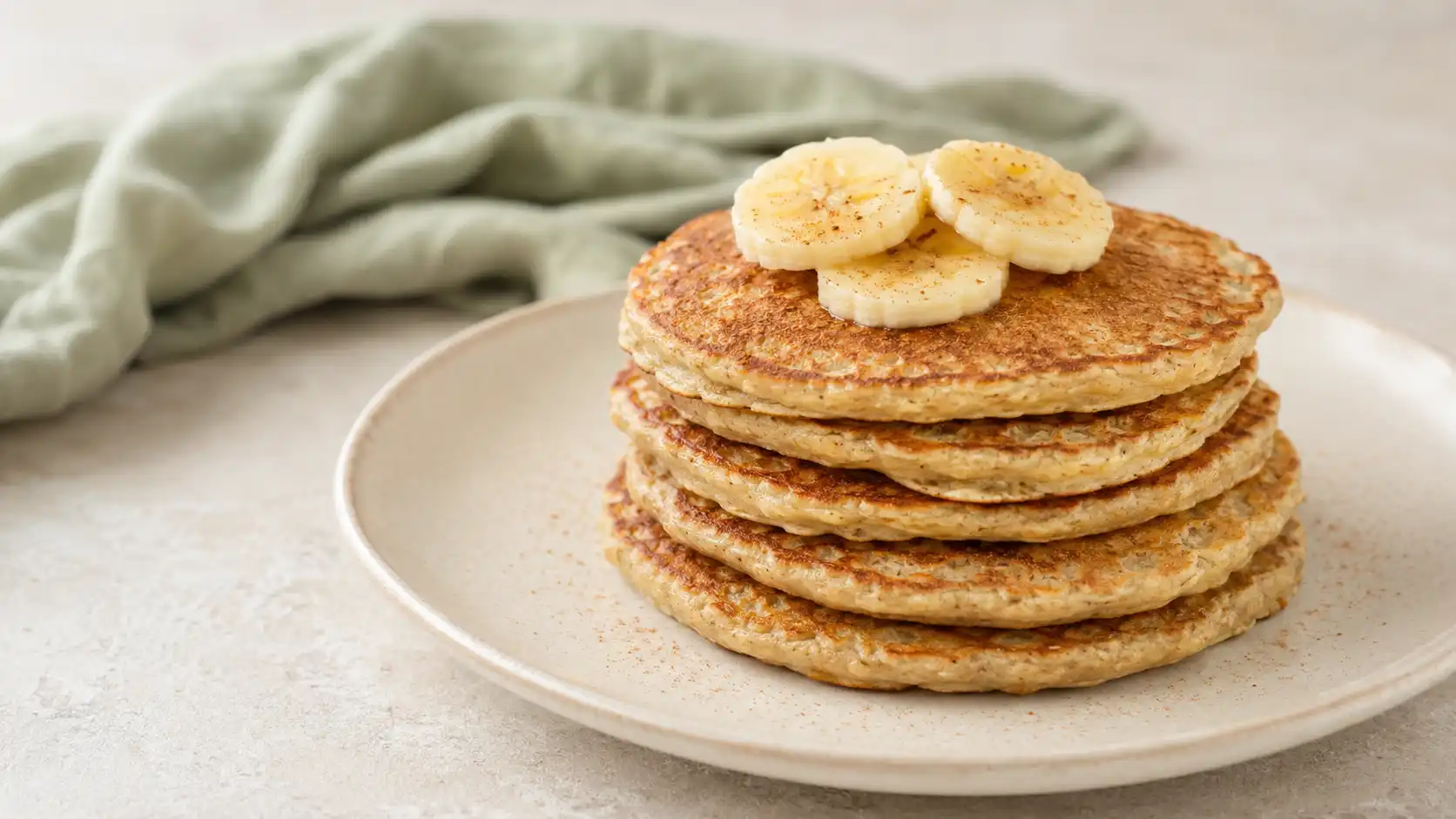 Labeled ingredients for banana protein pancakes including banana, eggs, oats, whey powder, milk, and seasonings